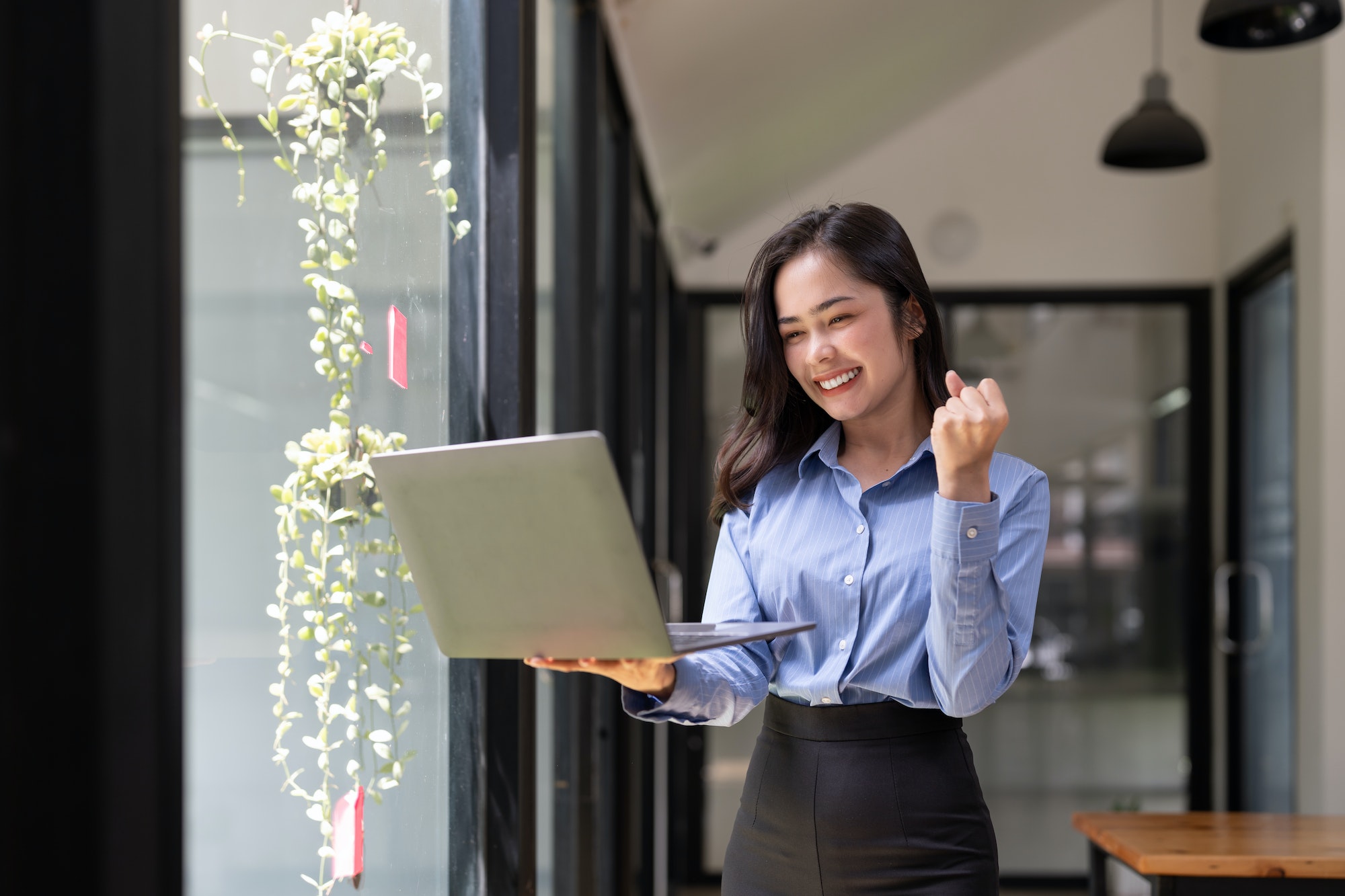 Beautiful asian young woman excited and glad of success with laptop computer, career freelance